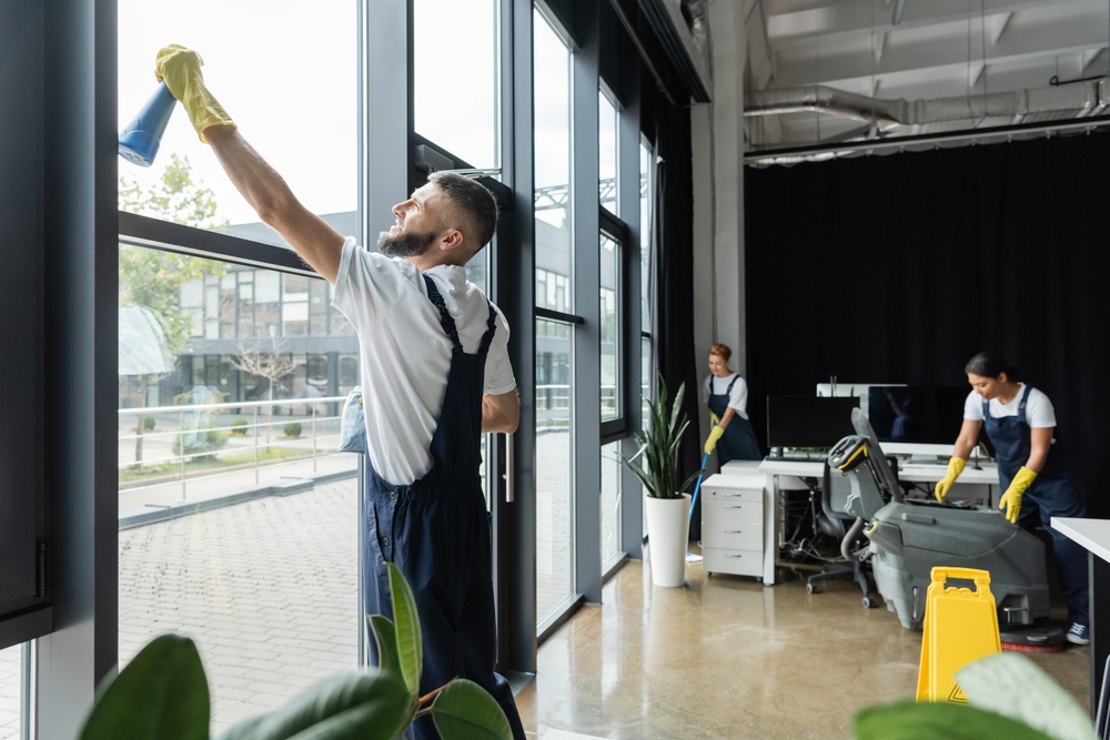 NECS cleaning an office workspace